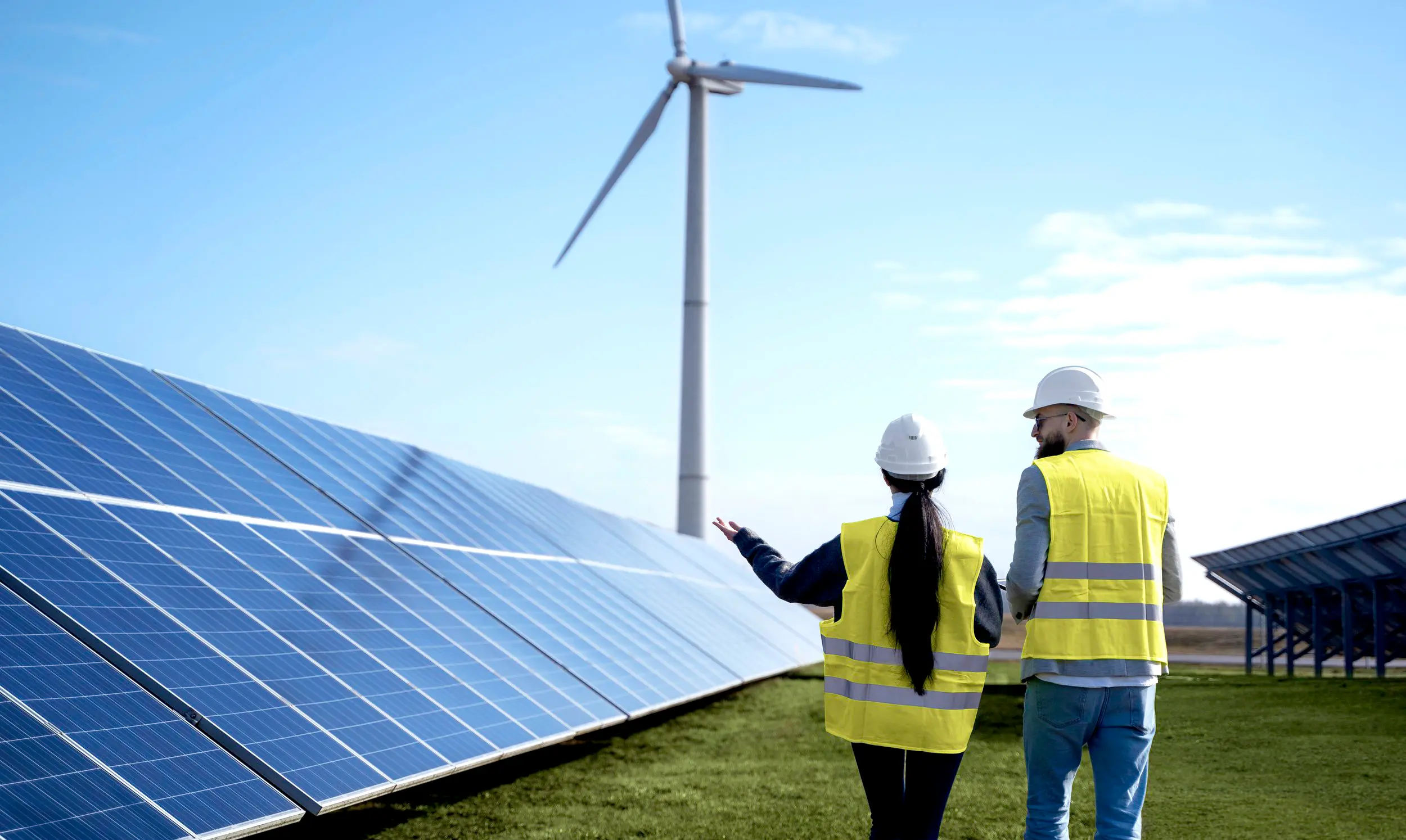 Engineers discussing about solar pannels