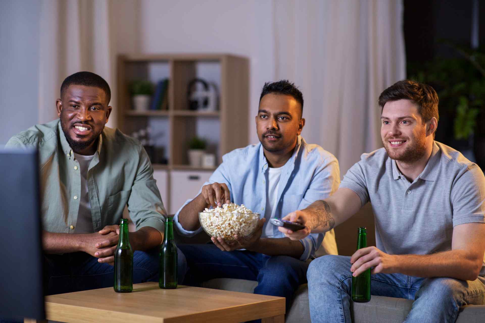 Guys hanging out watching tv