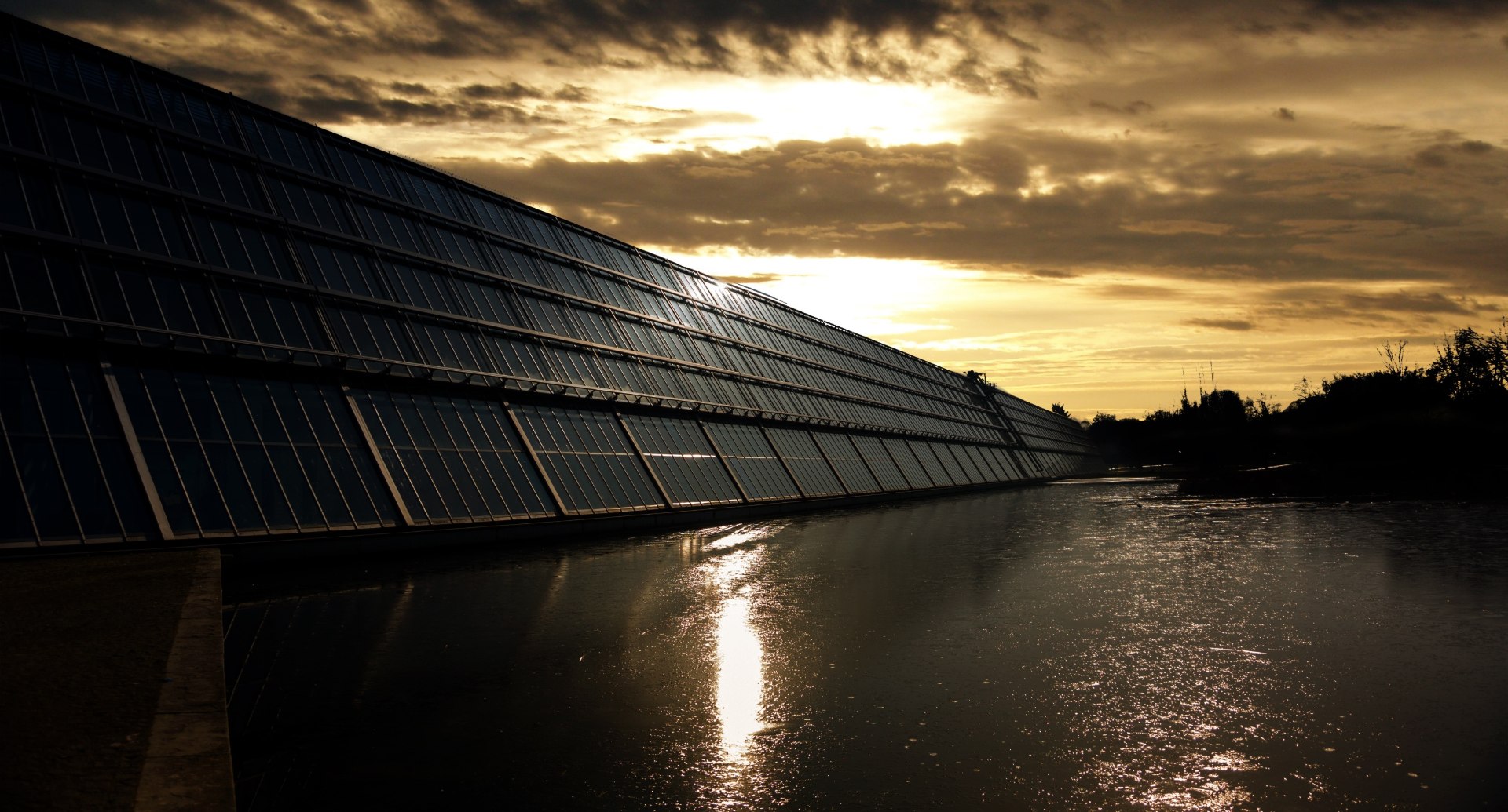 Just How Renewable Is Solar Energy? Examining This Clean Power Source 3 Photovoltaic solar panels above a body of water