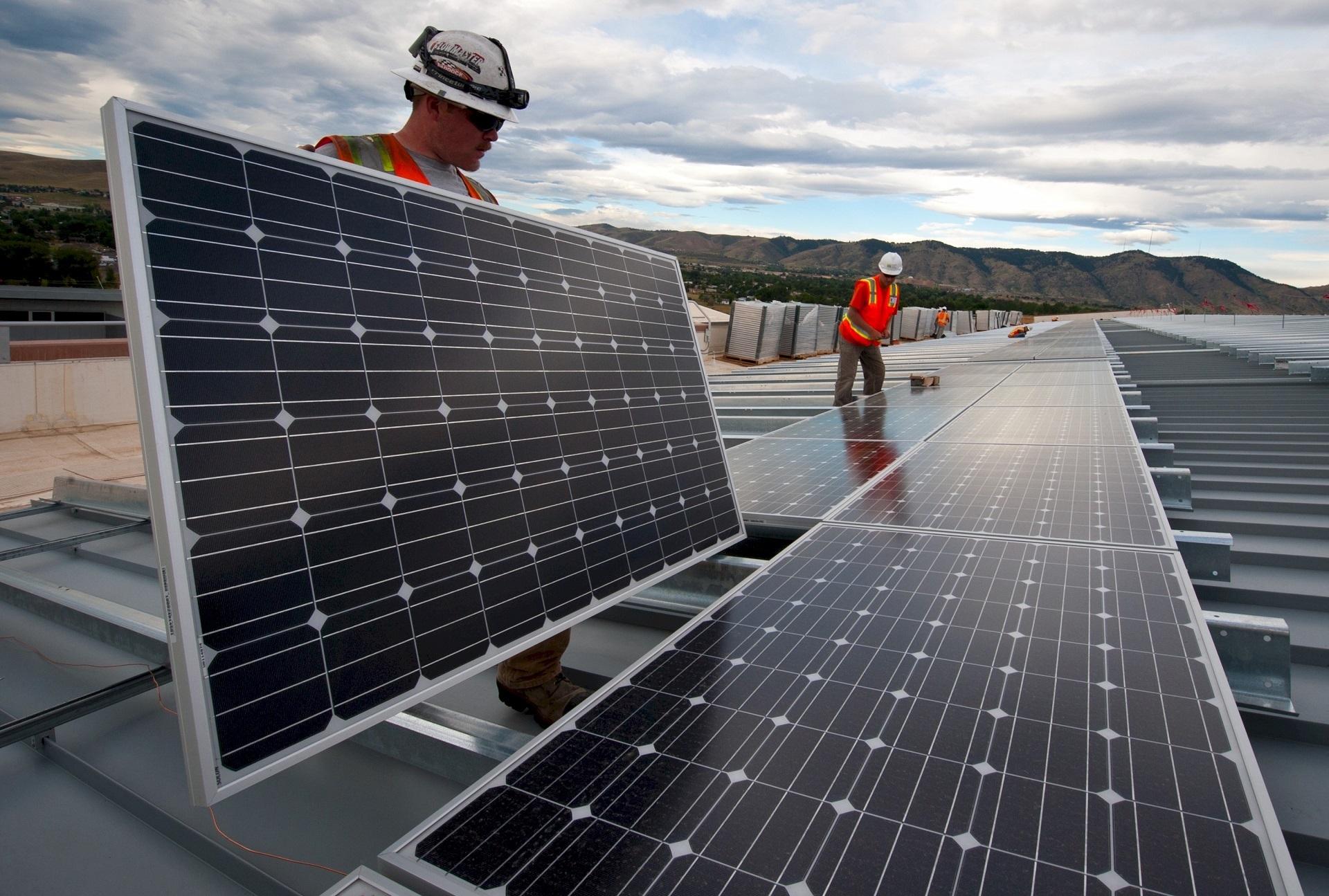 Just How Renewable Is Solar Energy? Examining This Clean Power Source 6 Photovoltaic solar panels being installed on a utility-scale solar farm