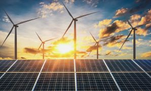 wind turbine with solar panels and sunset. concept clean energy
