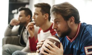 Three guys watching a football game